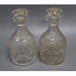 A pair of Georgian cut glass decanters and stoppers height 23cm