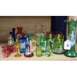 A collection of Mary Gregory style coloured enamelled glassware, including a green frilled vase,