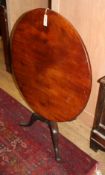 A George III mahogany circular tilt top table on pillar and tripod base Diameter 84cm