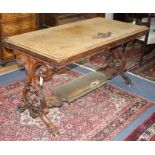 A Victorian carved walnut centre table W.142cm