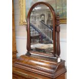 A Victorian walnut toilet mirror with hinged box base H.86cm