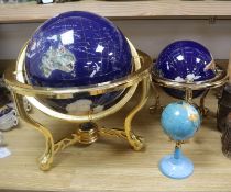 Three hardstone inlaid terrestrial globes on brass stands