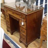 A George III mahogany kneehole desk with brushing slide W.96cm