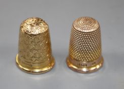 An early 20th century 15ct gold thimble, 5.3 grams and a 9ct gold thimble, by Charles Horner, 6