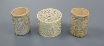 A pair of Chinese carved ivory pots and a Chinese ivory circular box and cover, 19th century