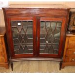 A mahogany concave front display cabinet W.102cm