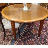 A circular burr walnut marble inset dining table Diameter 120cm