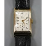 A gentleman's 1950's 9ct gold Record manual wind wrist watch, with rectangular starburst Arabic dial