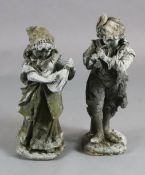 A pair of lead garden statues, modelled as a male horn player and female companion, H.1ft 10.5in.