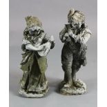 A pair of lead garden statues, modelled as a male horn player and female companion, H.1ft 10.5in.
