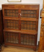 A pair of Minty, Oxford oak three-tier Globe Wernicke style bookcases W.89cm