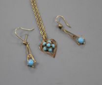 A pair of yellow metal and turquoise set drop earrings and a similar heart shaped pendant on a