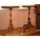 A pair of mahogany tripod wine tables Diameter 38cm