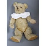 An early English bear 1930's, 17in., replaced paw pads, general thinning to mohair, glass eyes