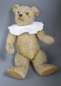 An early English bear 1930's, 17in., replaced paw pads, general thinning to mohair, glass eyes
