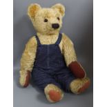 A large Chad Valley 1950's bear, in blue dungarees, 27in., good condition with new paw pads