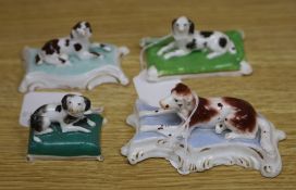 Four Staffordshire porcelain recumbent figures of three spaniels and a setter, c.1835-50, the