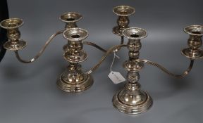 A pair of plated three light candelabra