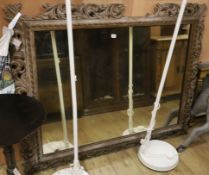 A large 19th century carved parcel gilt oak overmantel mirror W.156cm