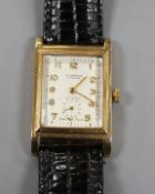 A gentleman's 1960's 9ct gold J.W. Benson manual wind wrist watch, with Arabic dial and subsidiary