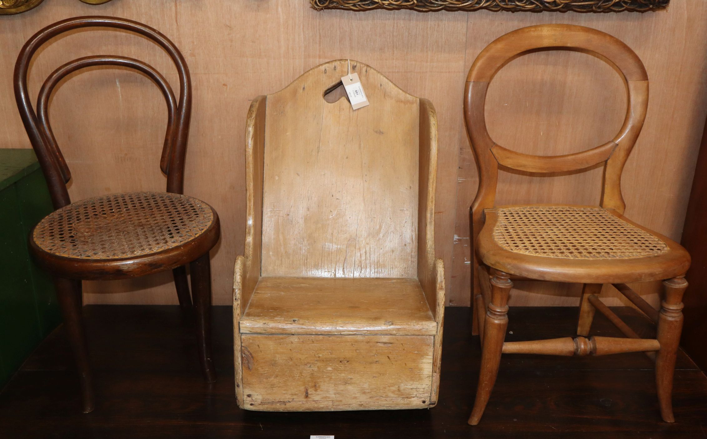 A 19th century pine child's rocking chair and two later cane seat childs chairs