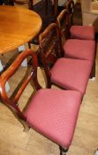 A set of five Victorian mahogany buckle back dining chairs with stuffover seats and a similar chair