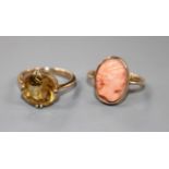 A yellow metal and coral oval cameo ring and a 9ct and citrine set ring. Cameo ring size F,