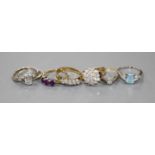 Four 18ct gold and diamond set dress rings, an 18ct gold aquamarine and diamond dress ring and two