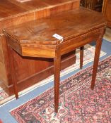 A George III mahogany folding tea table W.90cm