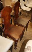 A pair of Victorian mahogany hall chairs