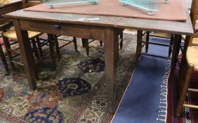 A 19th century French oak drop flap kitchen table W.130cm (extended)