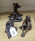 A small bronze kneeling nude, initialled 'TG', edition of 30, a similar seated nude and two