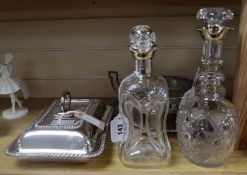 A silver-mounted dimple decanter, a similar cut glass decanter, a plated entree dish and two other