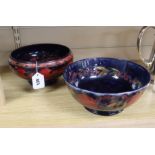 A Moorcroft flambe 'Banded Pomegranate' footed bowl and a similar plain Pomegranate bowl, the former