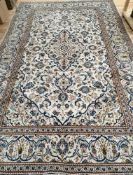 A Tabriz ivory ground carpet 300 x 200cm