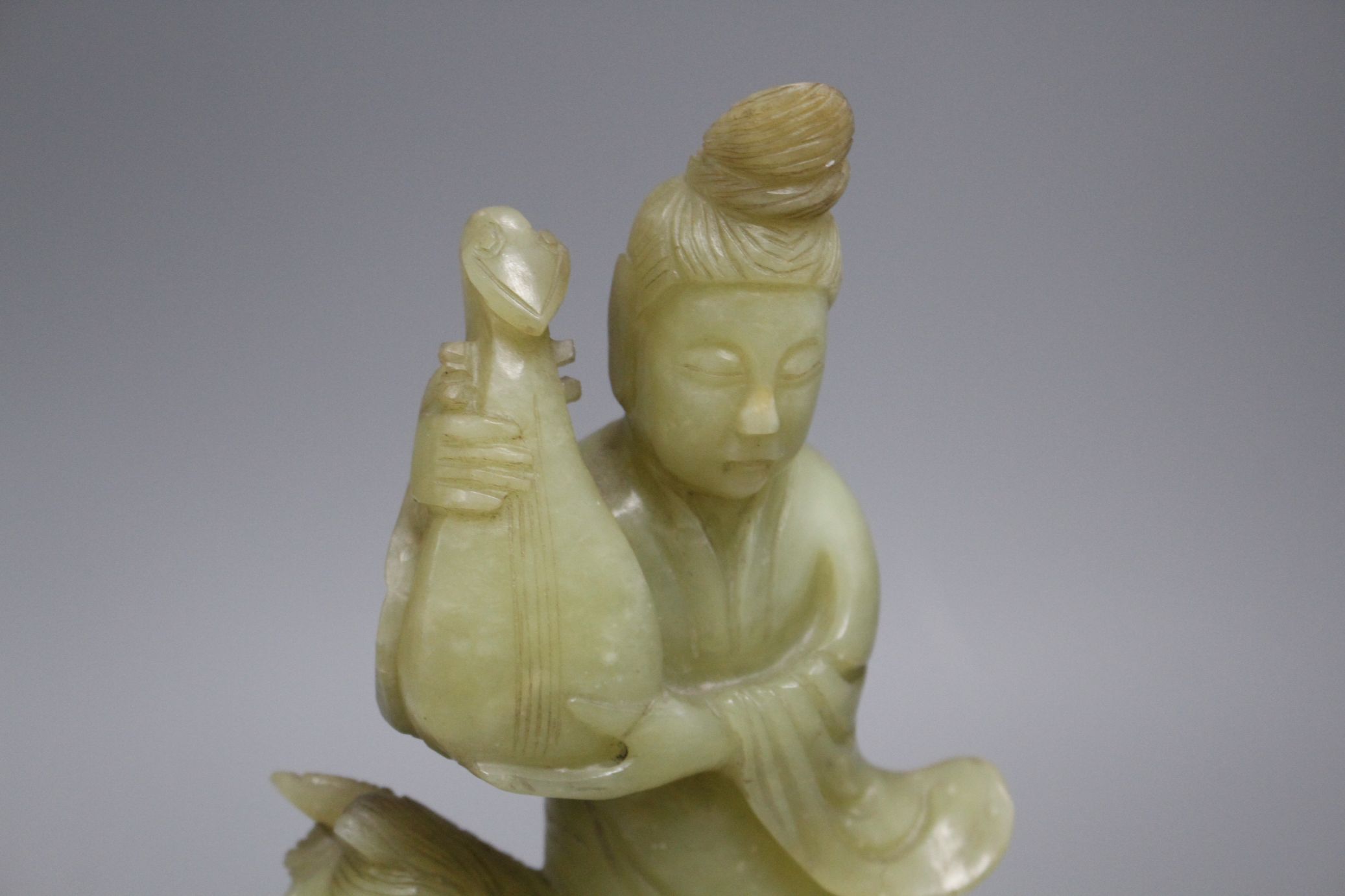A pair of Chinese bowenite jade groups of a lady riding a horse, wood stands natural inclusions - Image 6 of 9
