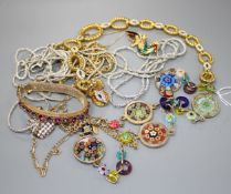 Seven assorted costume necklaces including a millefiore glass necklace, a costume bird brooch and