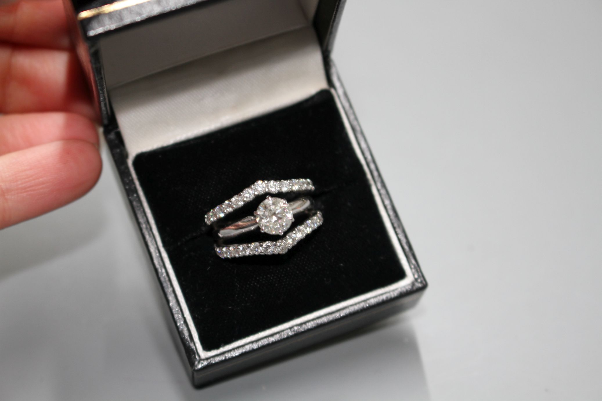 A modern 14kt white metal and triple band diamond dress ring, with two herringbone bands, each set - Image 2 of 7