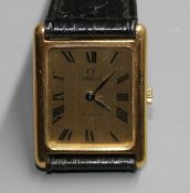 A gentleman's gold plated Omega De Ville quartz dress wrist watch, on associated strap. Condition: