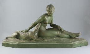 Luce. An Art Deco bronzed terracotta group of a seated nude maiden and hound, signed, width 31in.