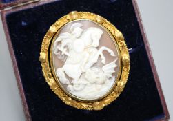 A Victorian yellow metal (tests as 15ct) mounted swivelling oval cameo brooch, carved with St George