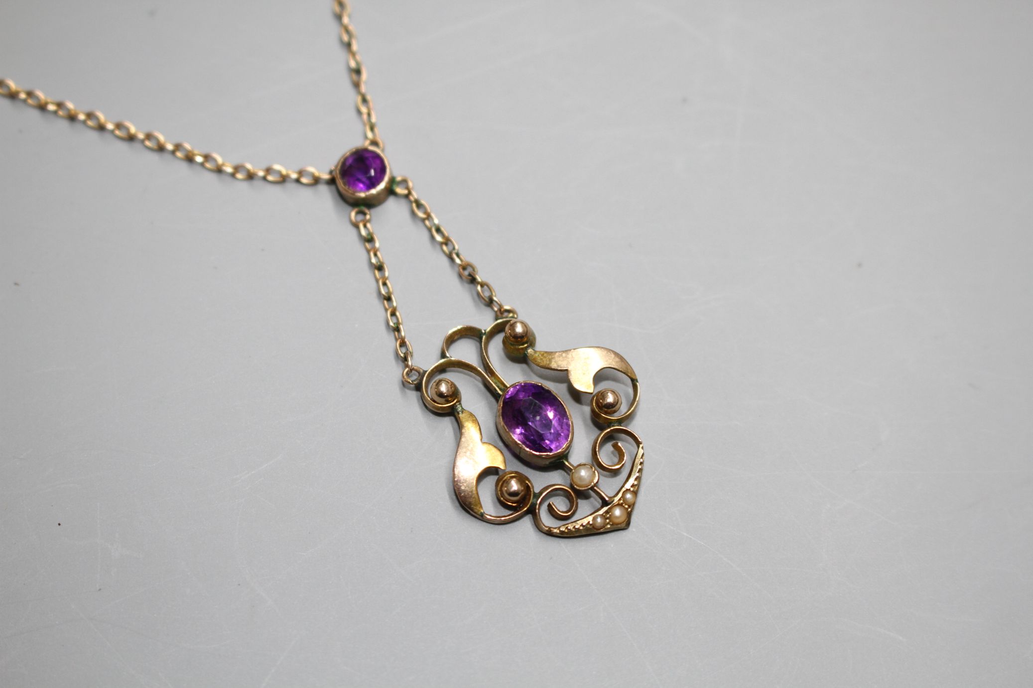 An Edwardian 9ct, amethyst and seed pearl set pendant necklace, pendant lower section 25mm. - Image 2 of 4