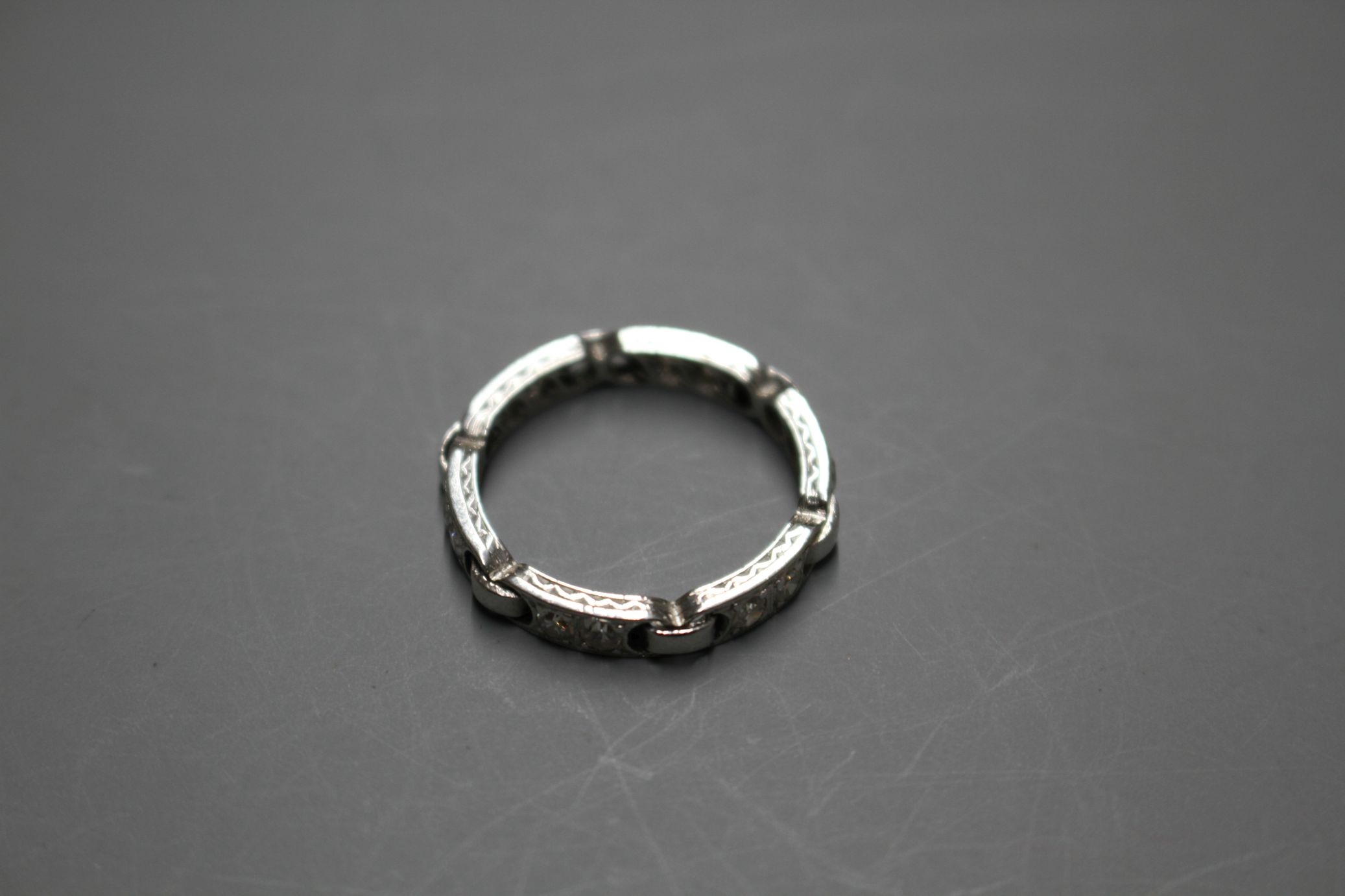 An unusual white metal (stamped Plat) and twelve stone diamond set eternity ring, with six 'chain' - Image 4 of 6