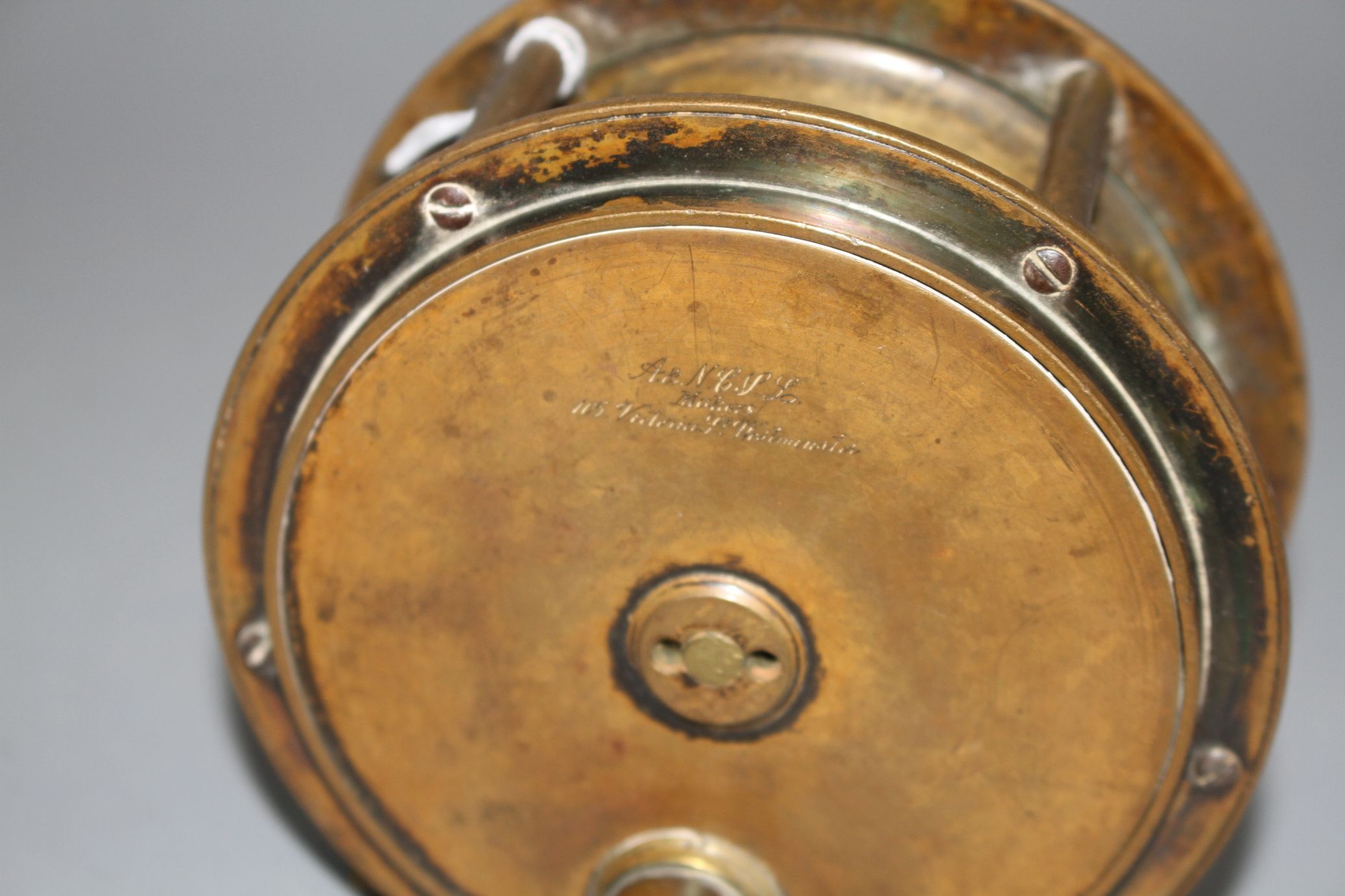 An early brass 4.5in. fishing reel by Army & Navy Cooperative Stores Ltd., engraved mark, diameter - Image 2 of 4