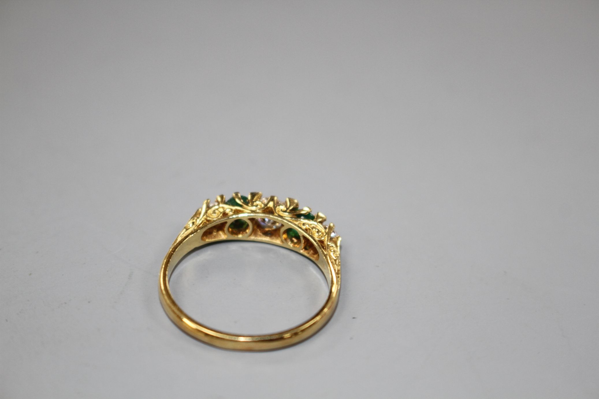 A modern Victorian style 18ct gold, two stone emerald and three stone diamond set half hoop ring, - Image 4 of 5