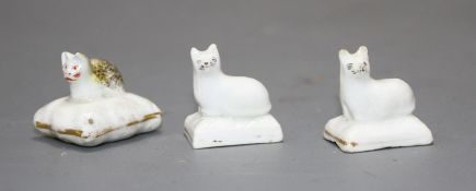 Three Staffordshire porcelain miniature models of recumbent kittens, c.1835-50, all with fine