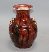 A Chinese flambe vase, with lion mask ring handles to the shoulder, fine crazing to the glaze all
