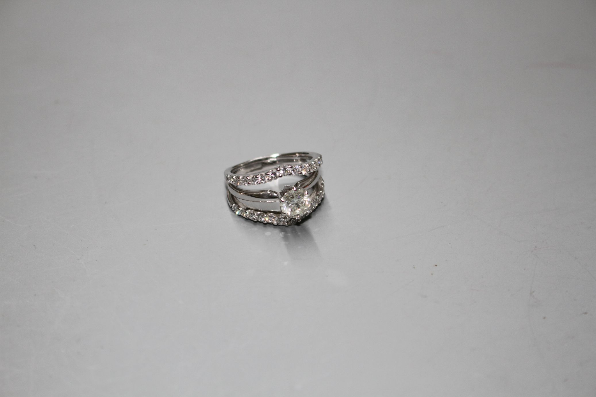 A modern 14kt white metal and triple band diamond dress ring, with two herringbone bands, each set - Image 3 of 7