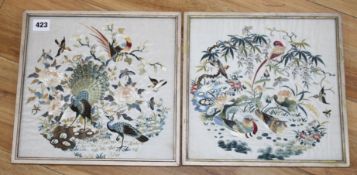 A set of four Chinese silkwork panels depicting birds and flowers, housed back to back in two