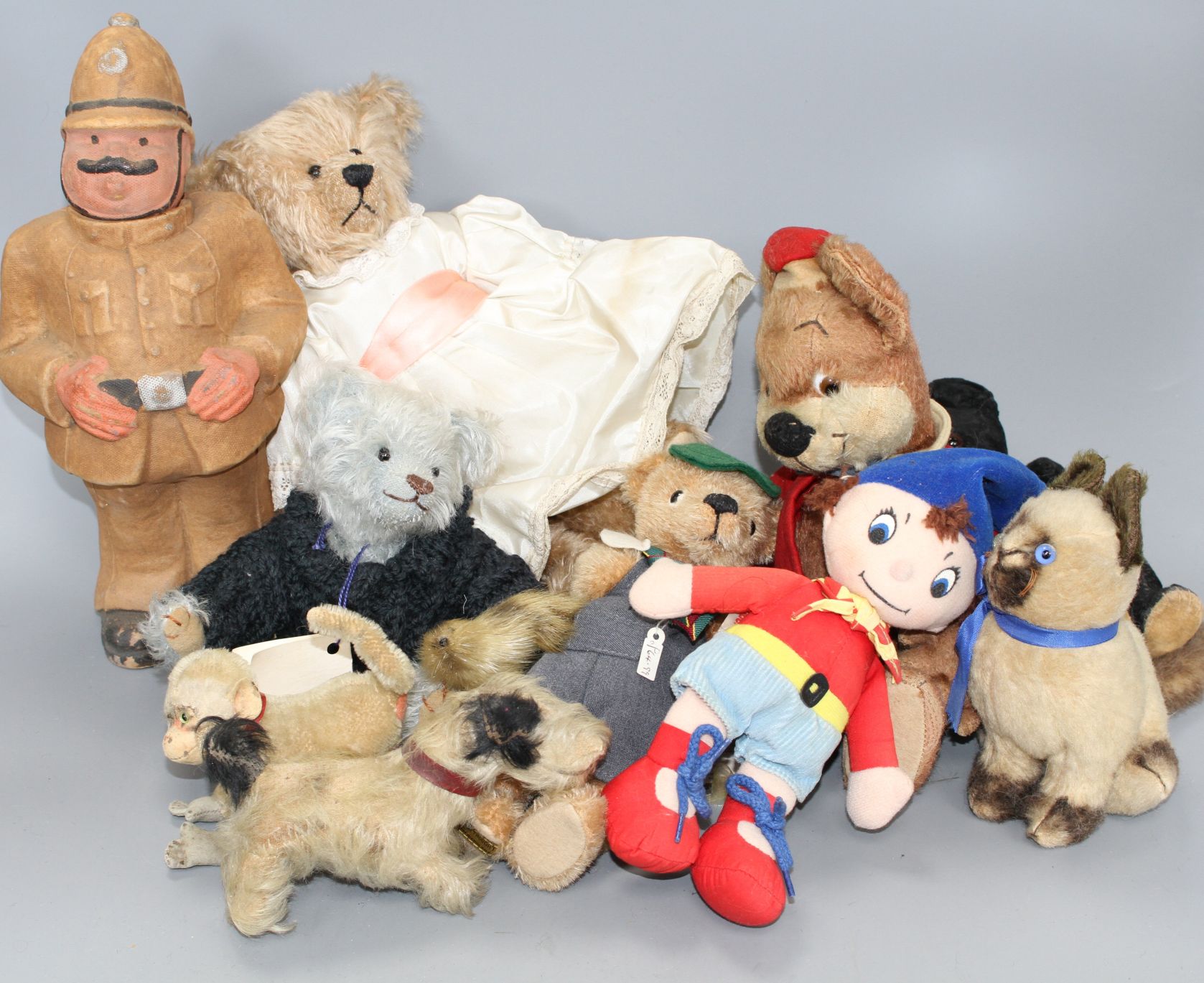 Noddy and Knoll bears, Merrythought Vintage Siamese cat, a Steiff monkey and Carobard character